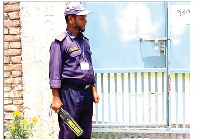 Security officer with metal detector